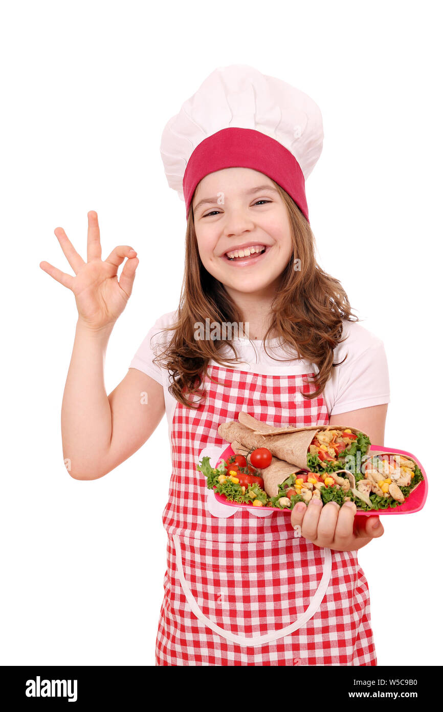 Happy little girl cook with burritos mexican food Stock Photo