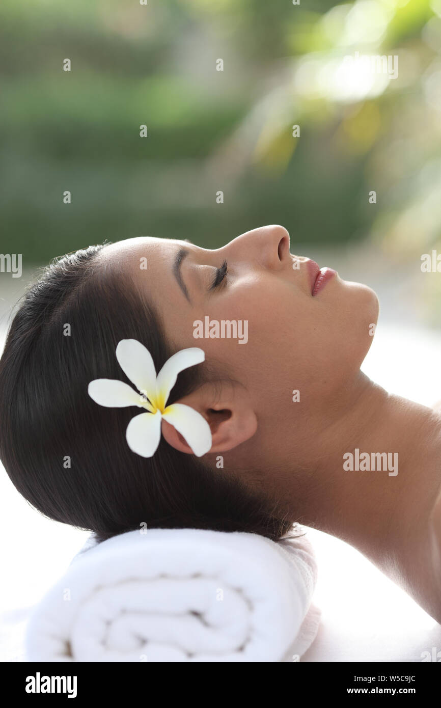 Woman relaxing on a massage table Stock Photo
