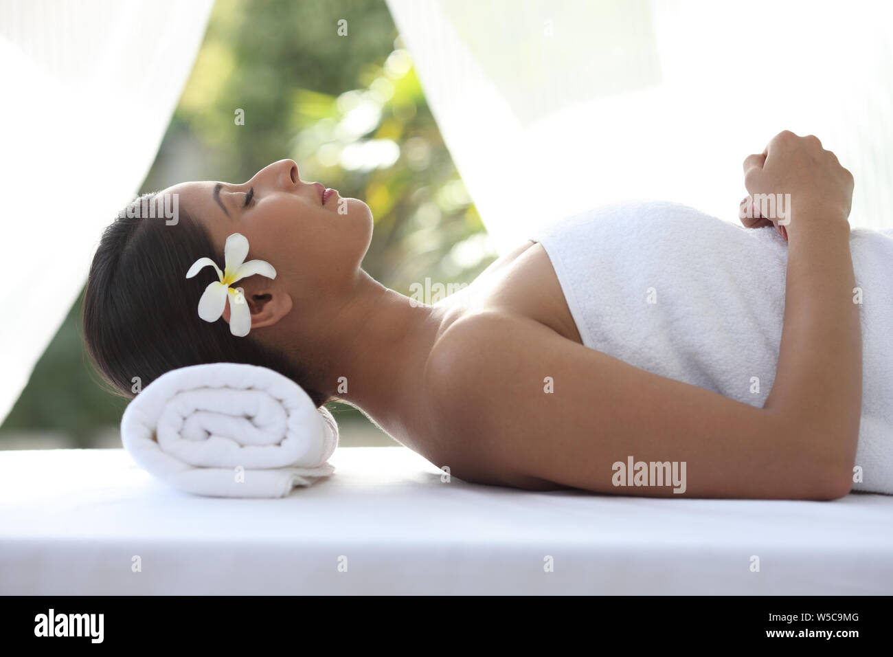 Woman relaxing on a massage table Stock Photo