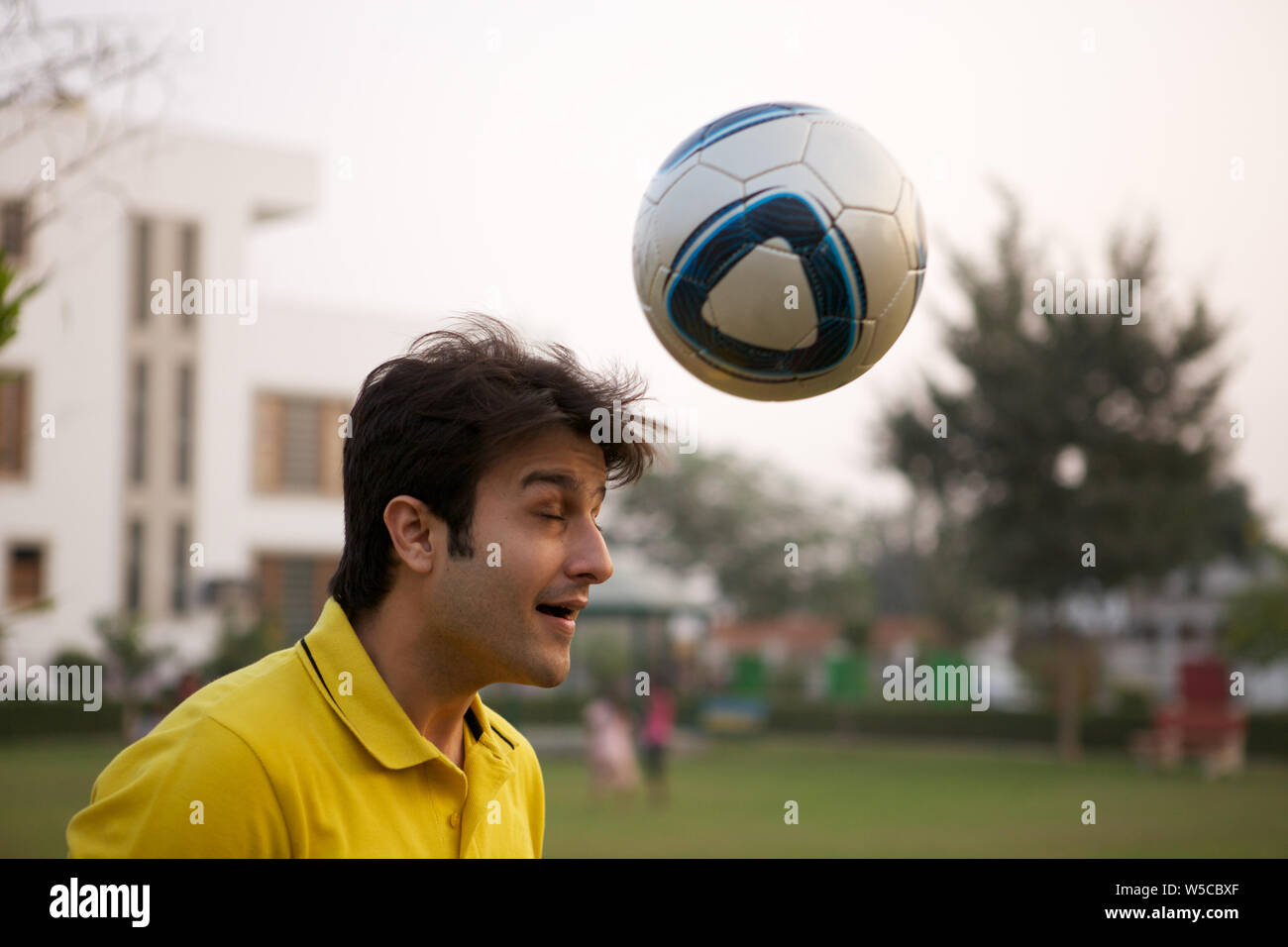 Soccer player hitting a ball with his head Stock Photo Alamy