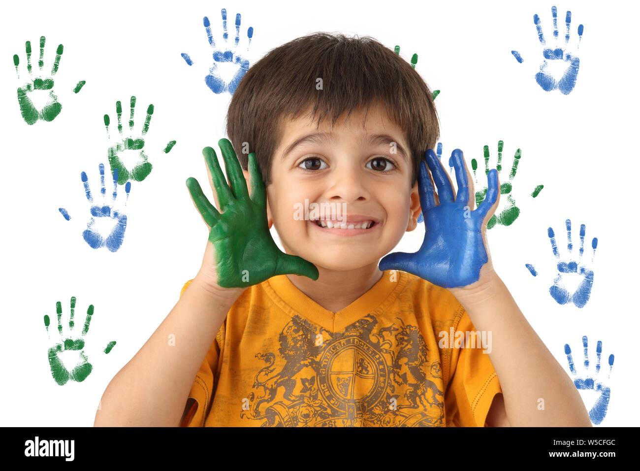 Portrait of a boy showing painted hands Stock Photo
