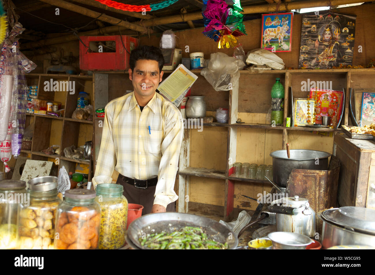 Shopkeeper smiling at a tea stall Stock Photo