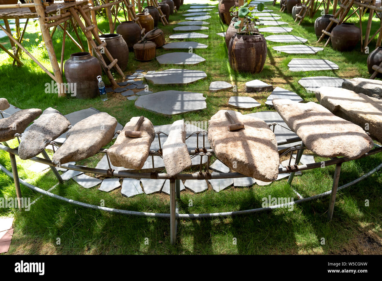 Phu Yen Province, Vietnam - July 21, 2019: Collection of ancient stones instruments in a display at The Sea Cliff of Stone Plates tourist area in Phu Stock Photo