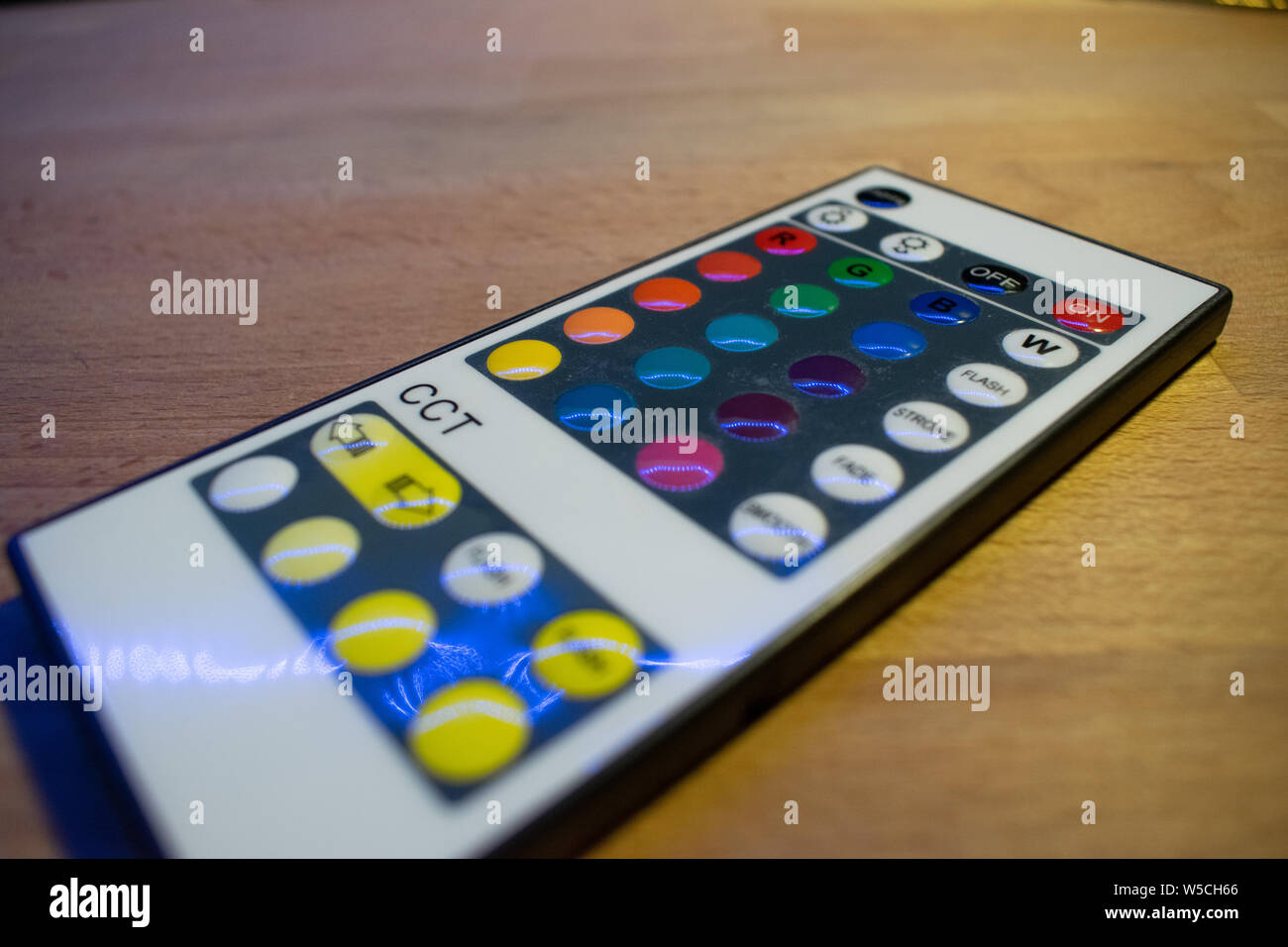 RGB led remote controller pointing to the led strip Stock Photo