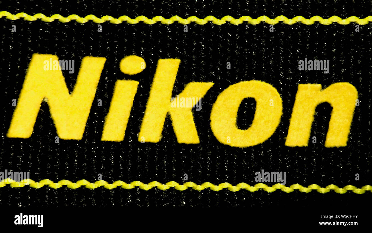 Macro of the Nikon logo written on a textile camera strap (the background  texture is the material of the strap Stock Photo - Alamy