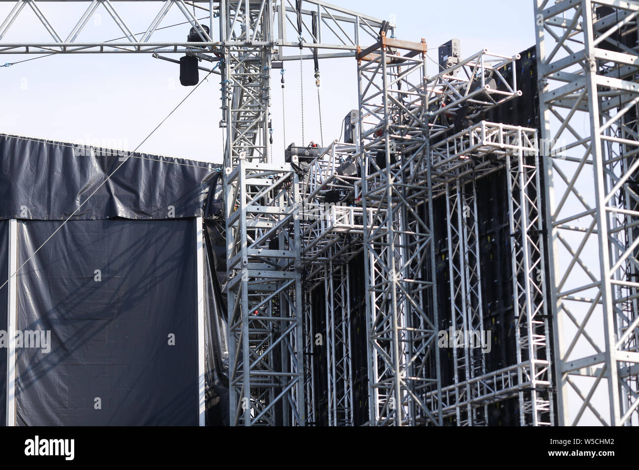 Details with the metallic structure of a large concert stage seen from behind, at a music festival Stock Photo