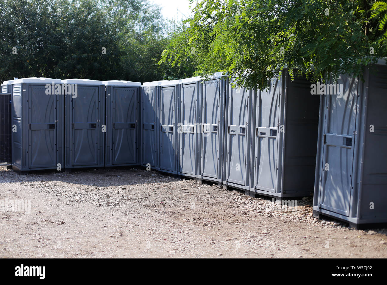 Ecological toilets in a row at a public event (music festival) Stock Photo