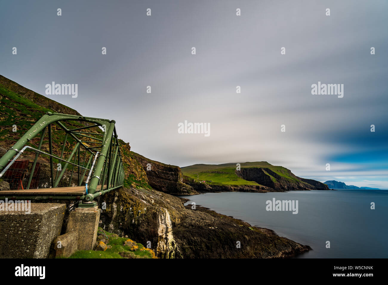Profile of Mykines susspension bridge in Faroe Islands, long exposure Stock Photo