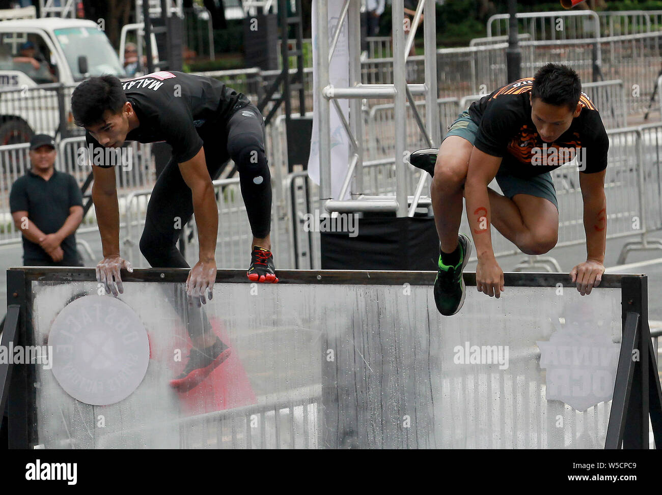 Manila, Philippines. 28th July, 2019. Contestants participate in the 2019 Asia Obstacle Course Race (OCR) Games in Manila, the Philippines, July 28, 2019. Credit: Rouelle Umali/Xinhua/Alamy Live News Stock Photo