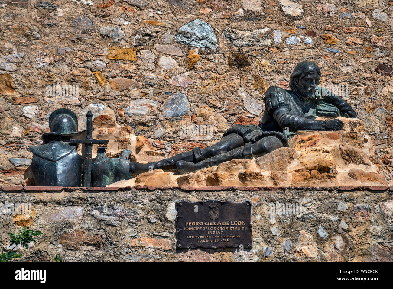 Sculpture of Pedro Cieza de Leon, 16th century conquistador and chronicler of Peru, at medieval wall in Llerena, Badajoz province, Extremadura, Spain Stock Photo
