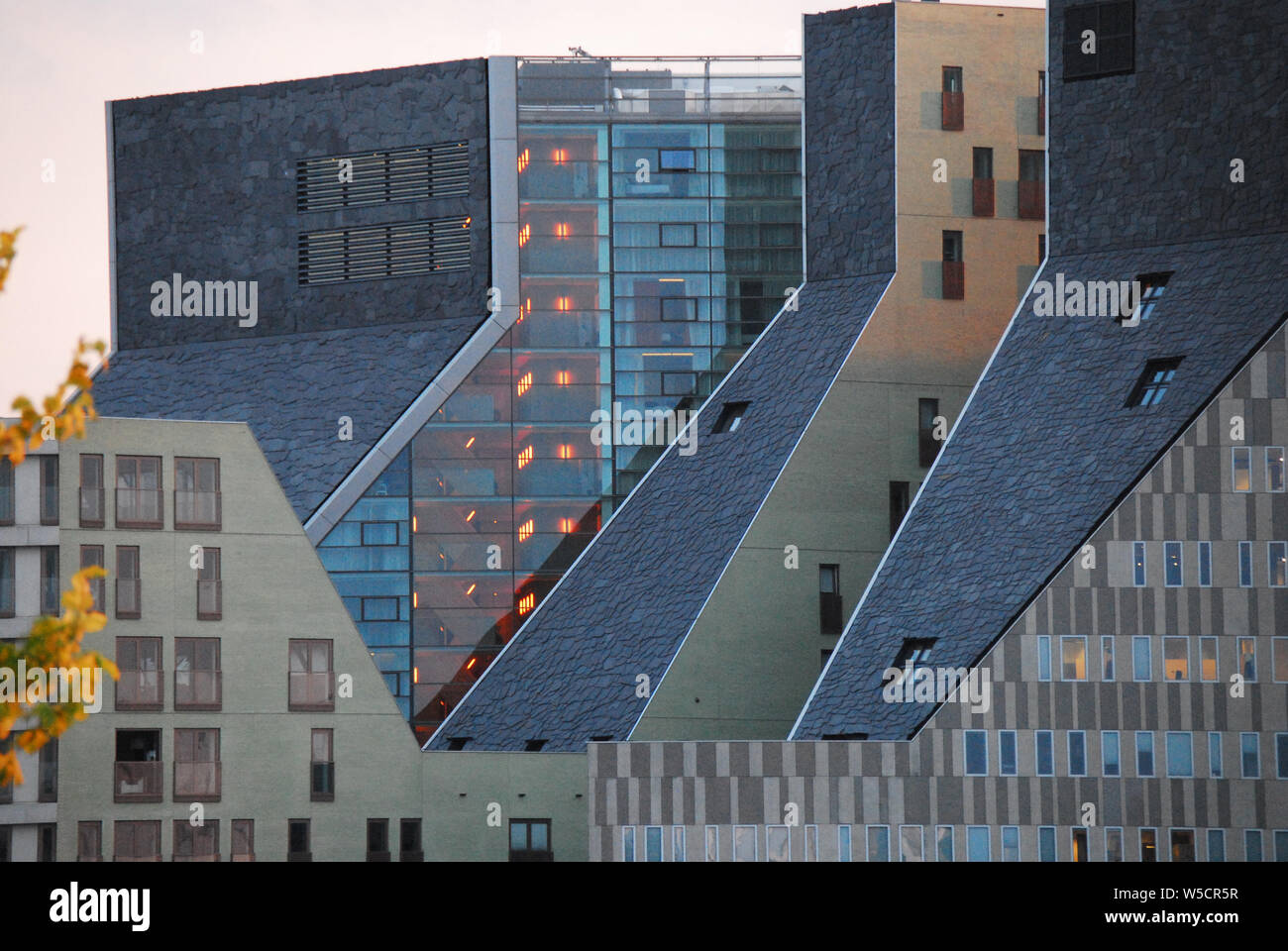 Modern architecture of buildings across the river and just a quick free ferry ride from the historic district of Amsterdam, Netherlands. Stock Photo