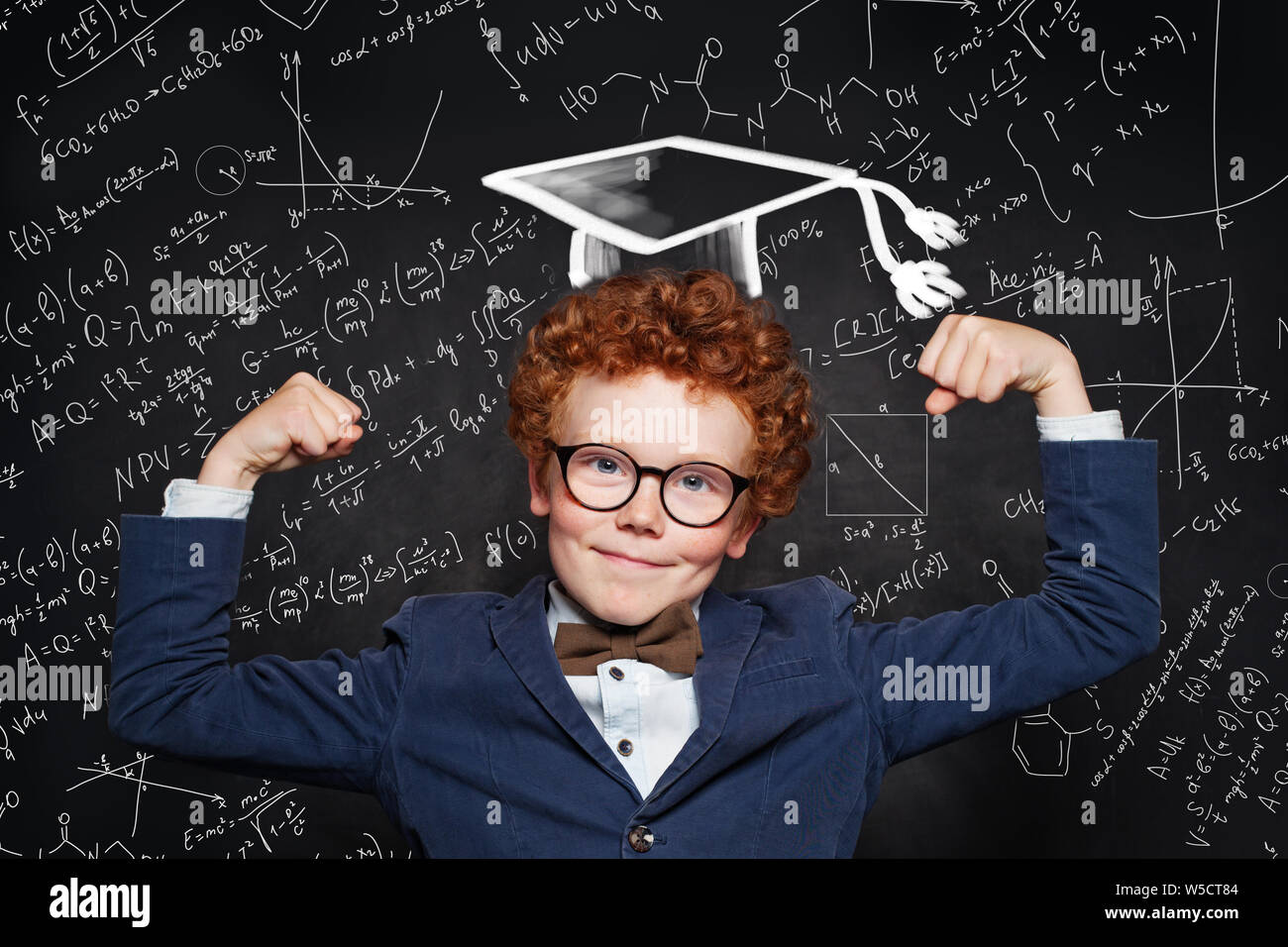 Happy funny kid student on blackboard background with science formulas  Stock Photo - Alamy