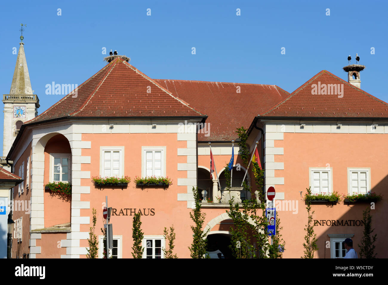 Rust: Town Hall, nest of white stork (Ciconia ciconia), Catholic parish church in Neusiedler See (Lake Neusiedl), Burgenland, Austria Stock Photo