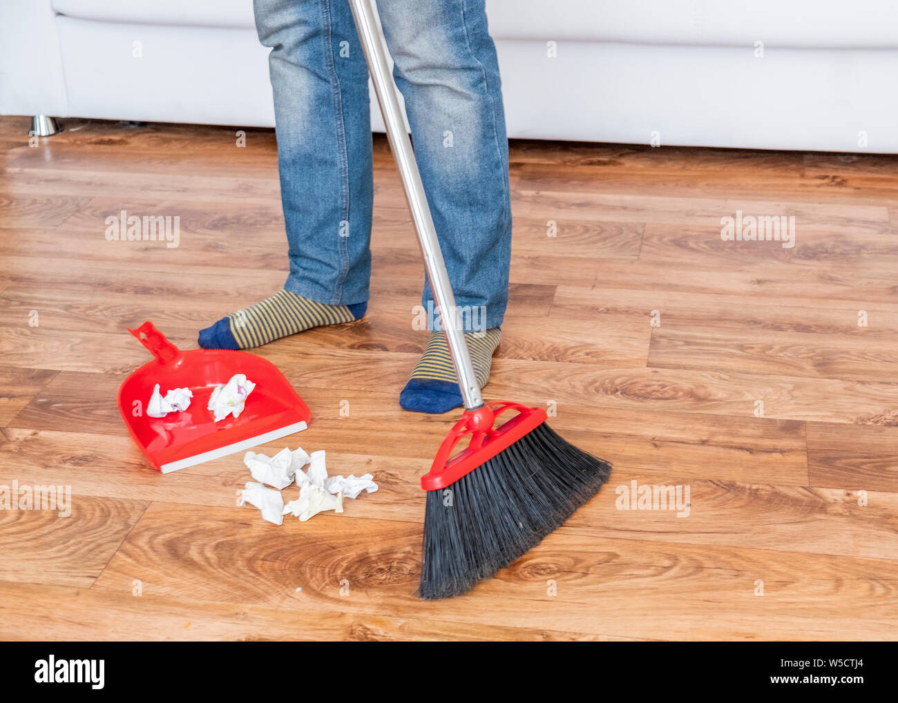 Closeup Cleaning Man Sweeping Wooden Floor With Broom Stock Photo