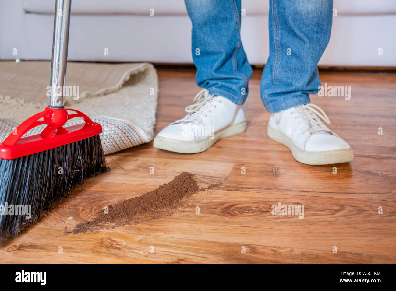Closeup Cleaning Man Sweeping Wooden Floor With Broom Stock Photo