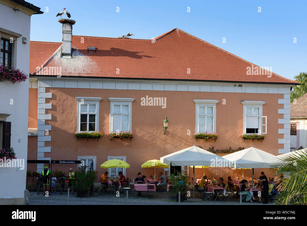 Rust: Town Hall, nest of white stork (Ciconia ciconia), restaurant in Neusiedler See (Lake Neusiedl), Burgenland, Austria Stock Photo