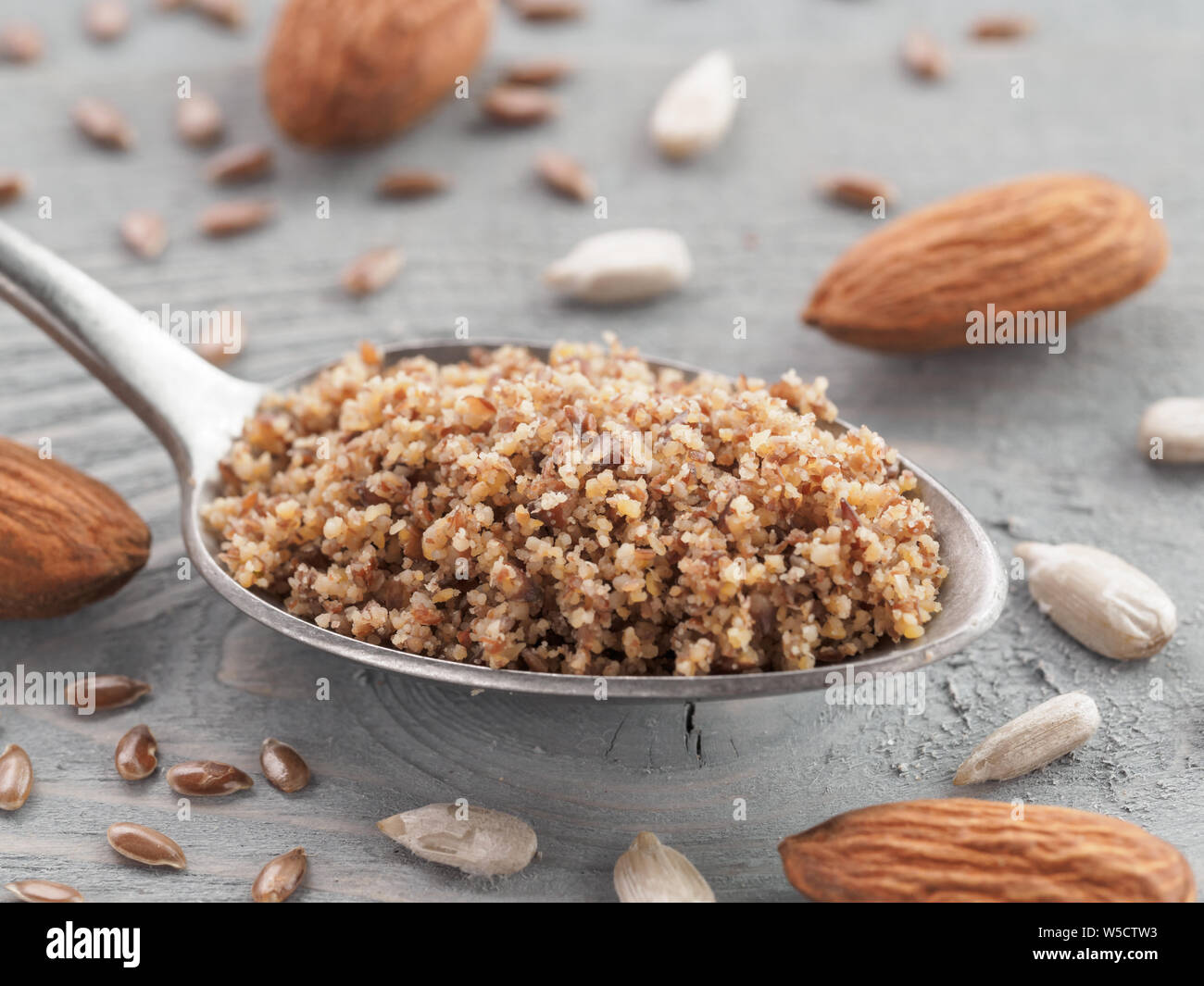 Homemade LSA mix in spoon Linseed or flax seeds, Sunflower seeds and