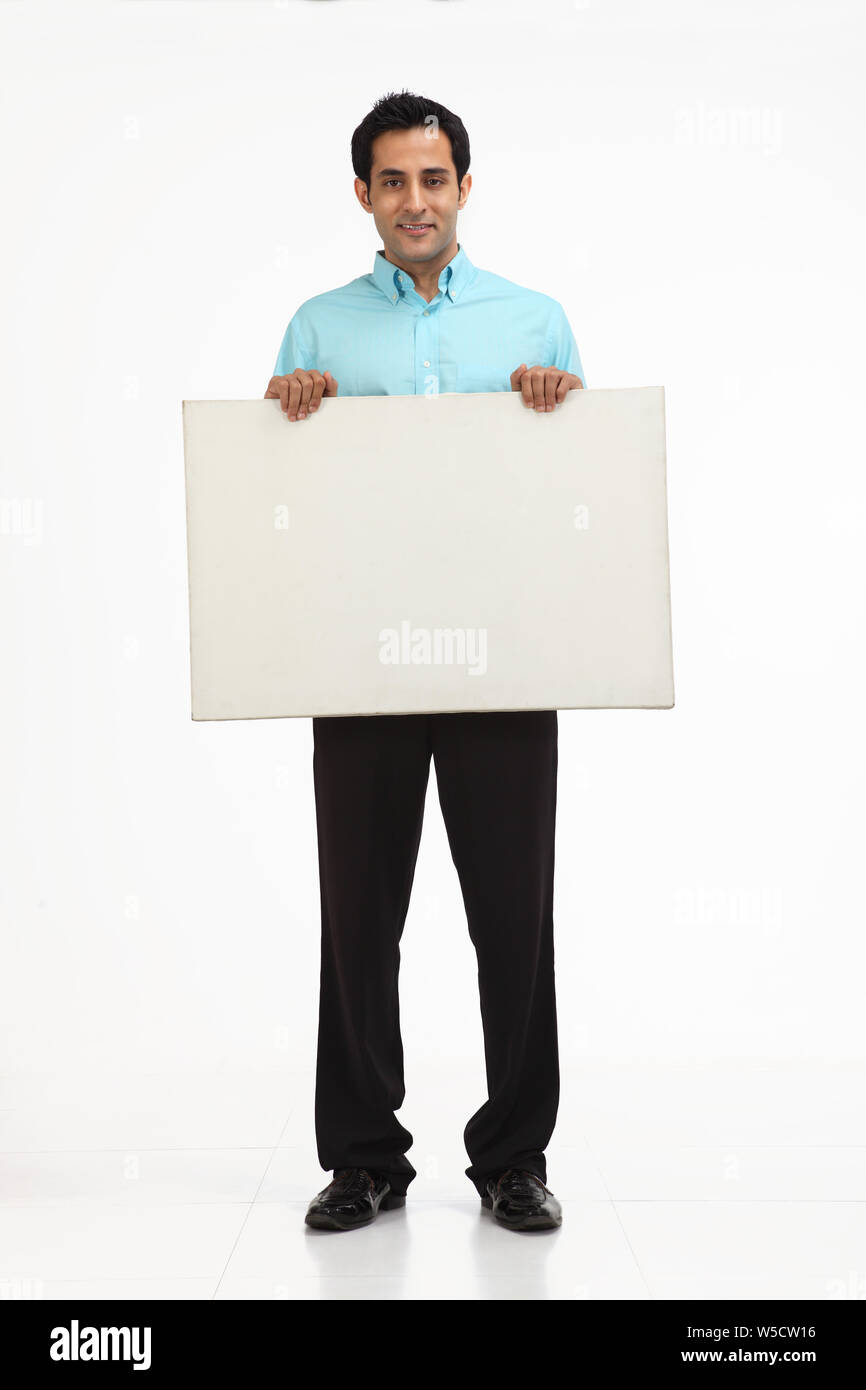 Businessman showing a placard Stock Photo