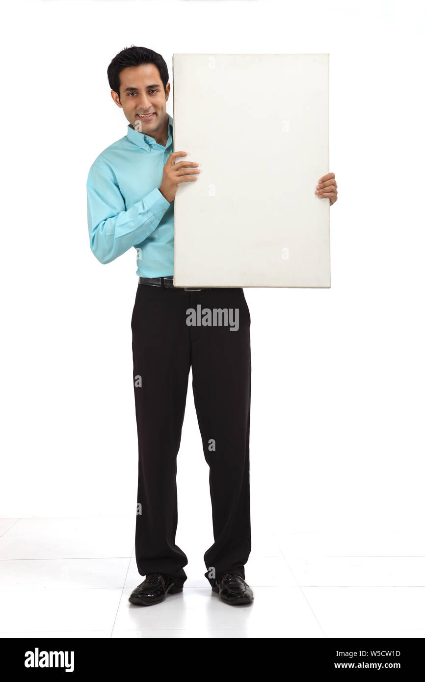 Businessman showing a placard Stock Photo