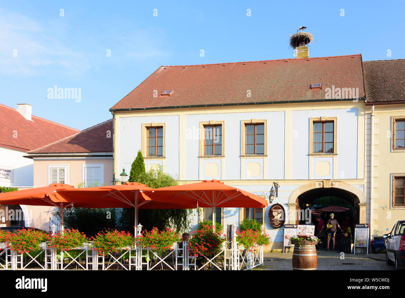 Rust: square Rathausplatz, nest of white stork (Ciconia ciconia), restaurant in Neusiedler See (Lake Neusiedl), Burgenland, Austria Stock Photo