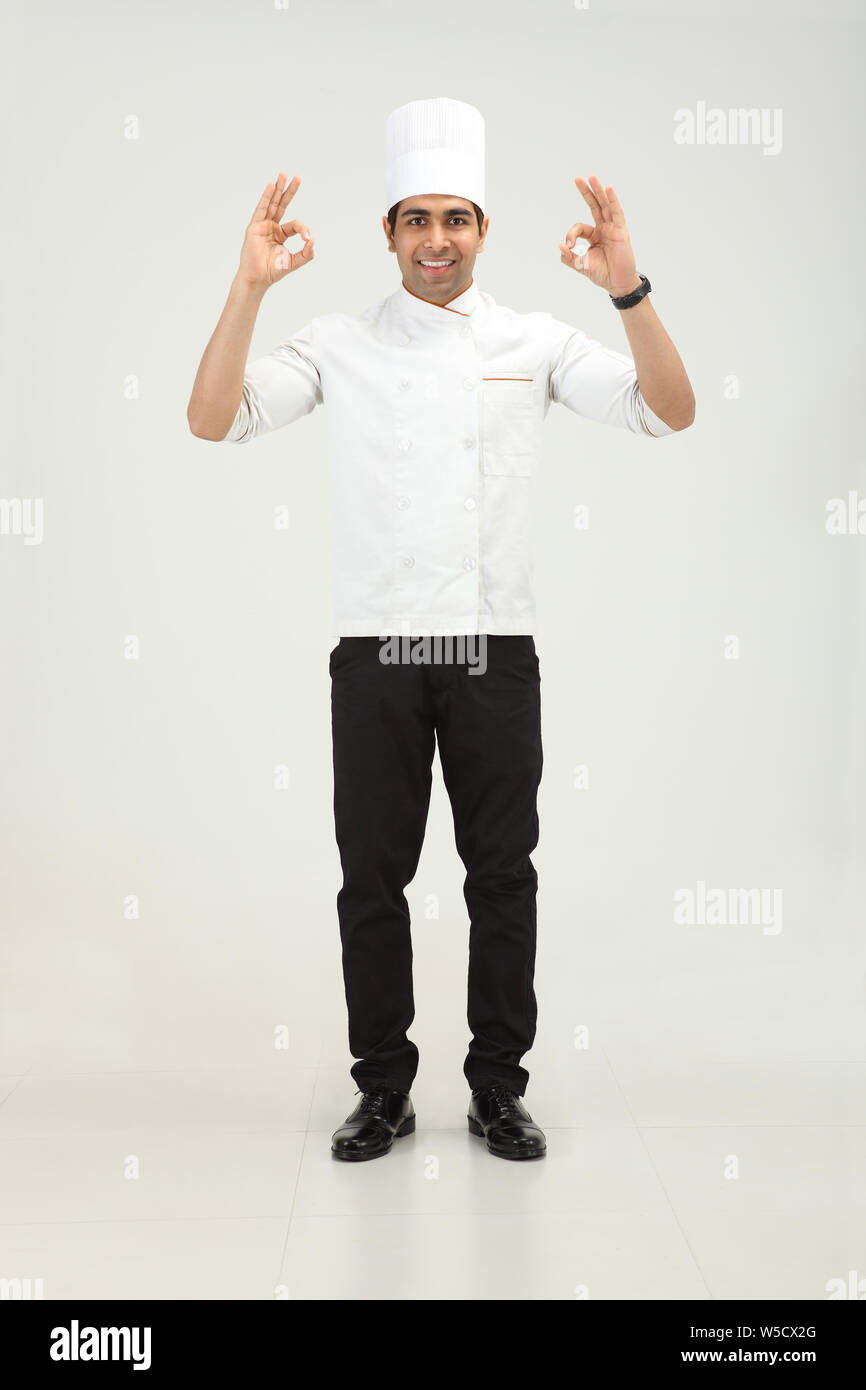 Chef showing ok sign and smiling Stock Photo