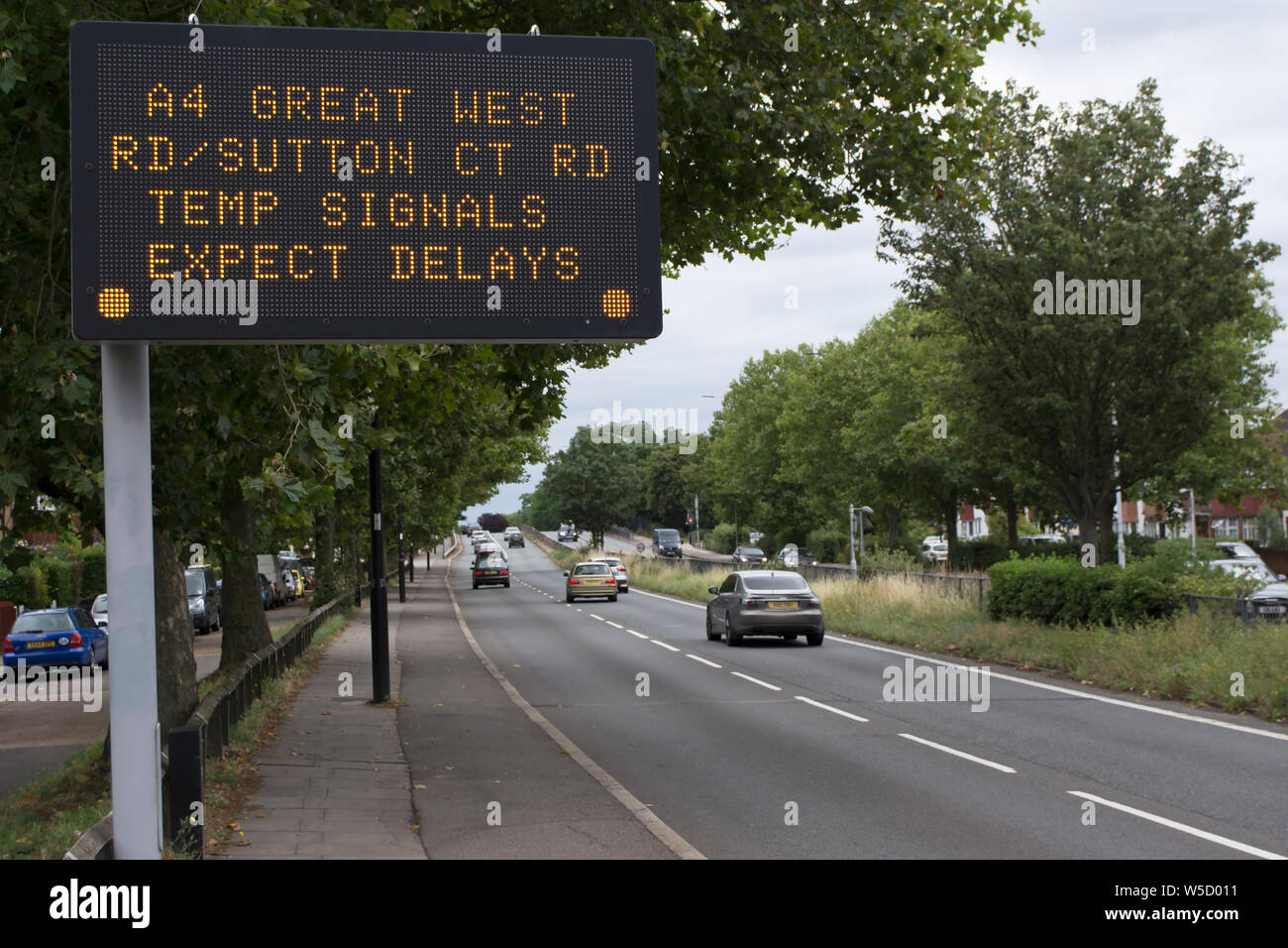 temporary british road sign warning of temporary signals and expected delays on the a4 great west road, in london, england Stock Photo