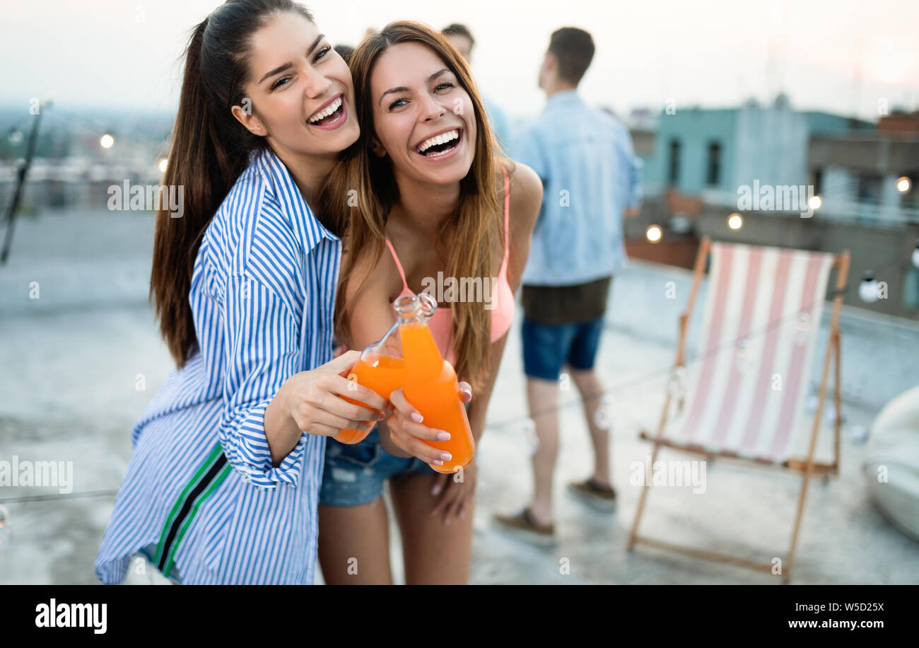 Happy young girls having fun at party Stock Photo - Alamy