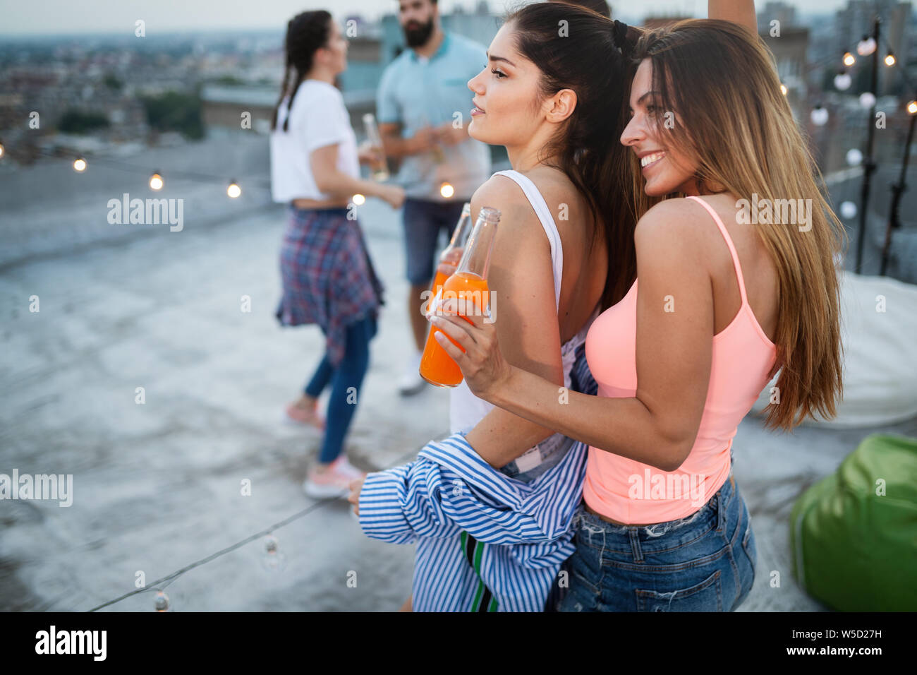 Happy young girls having fun at party Stock Photo - Alamy