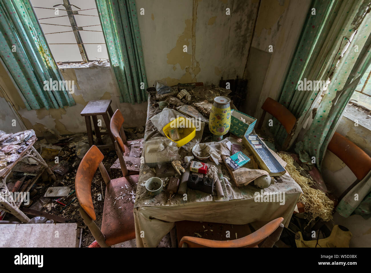 The interior of the abandoned house with household items in Ma Wan village, Hong Kong Stock Photo