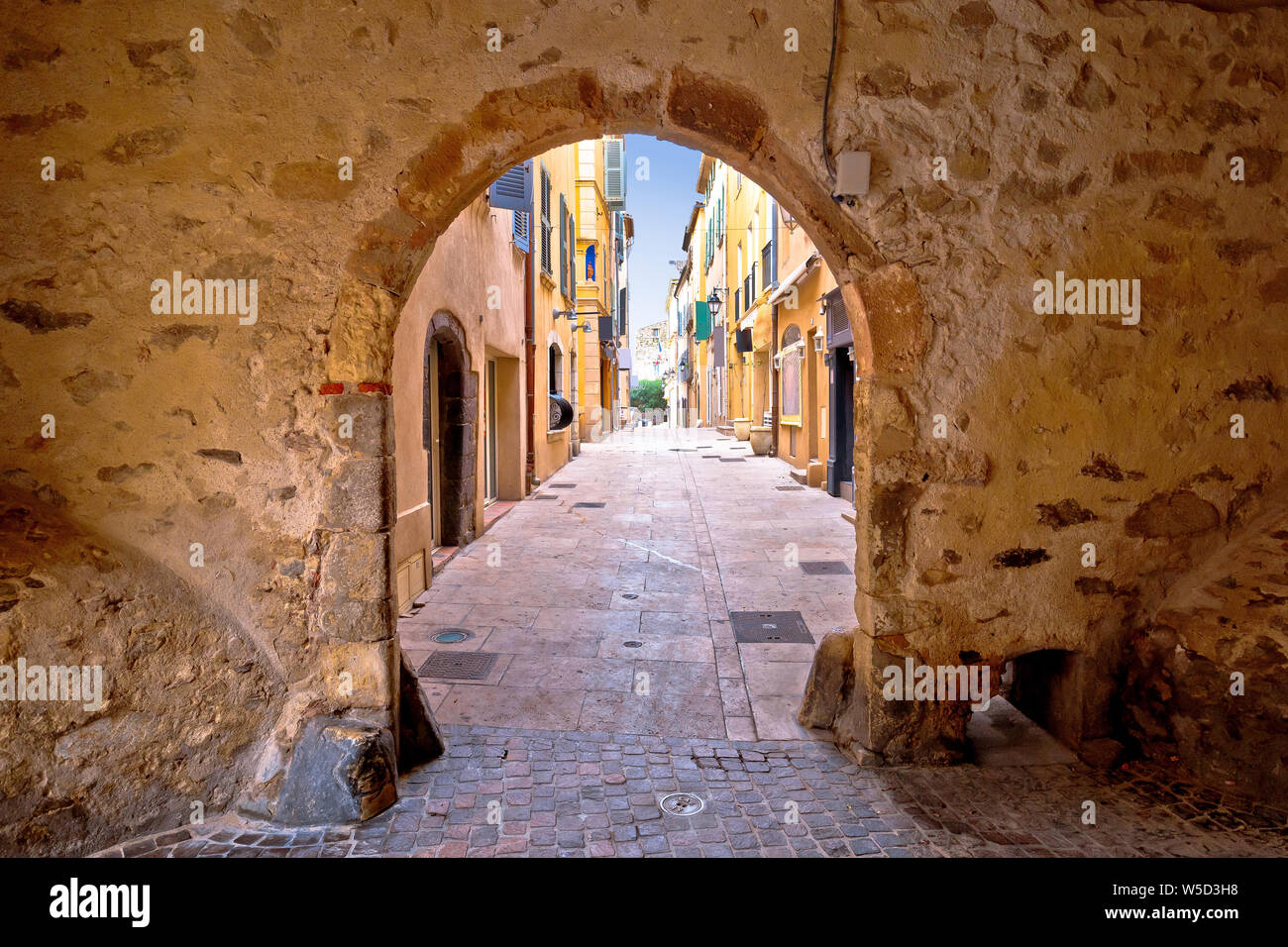 Saint Tropez historic town gate and colorful street view, tourist destination of French riviera Stock Photo