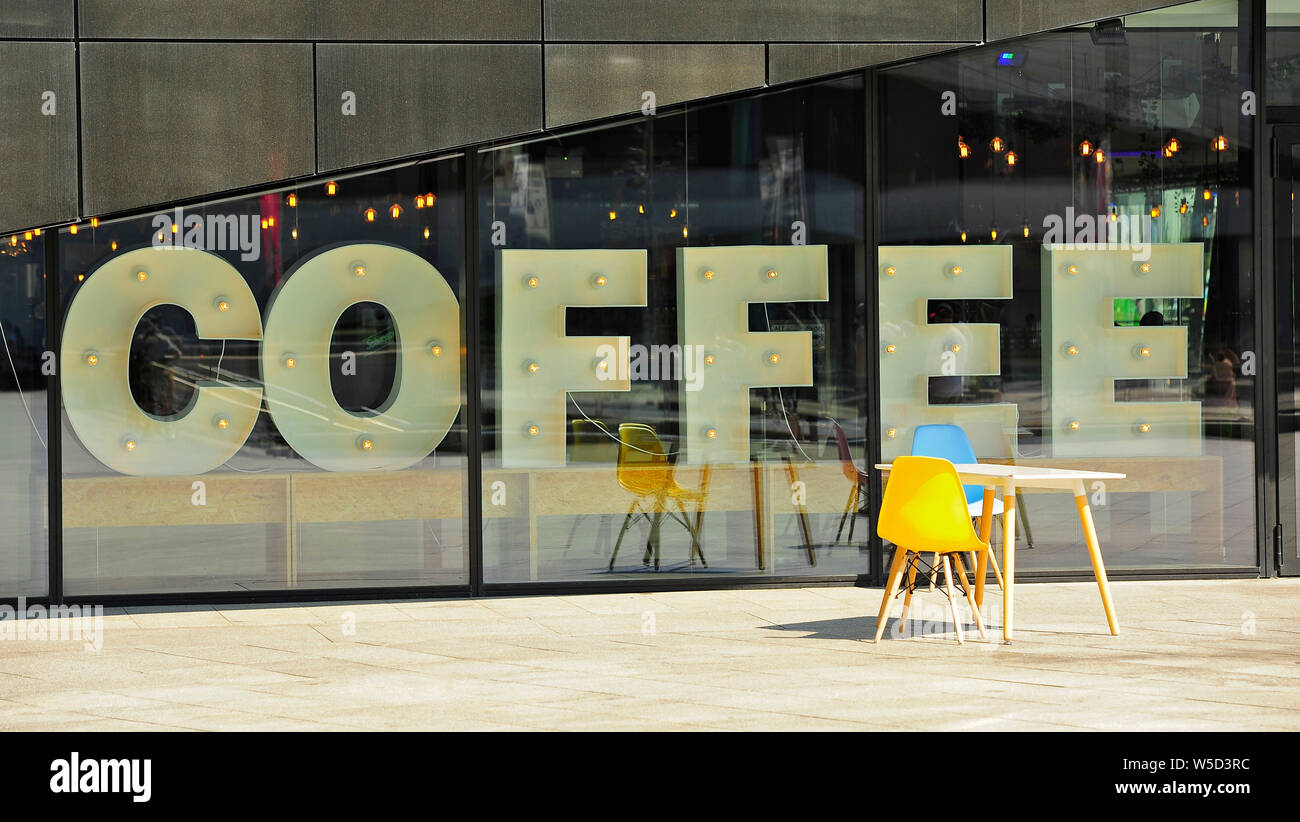 Table and two chairs sat outside a coffee shop on Albert Dock,Liverpool