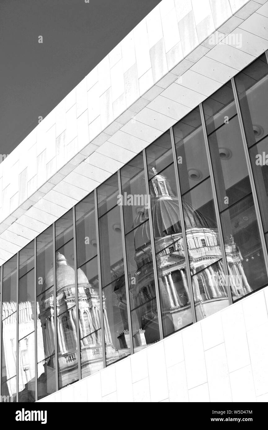 Port of Liverpool building reflected in the large front window of the Museum of Liverpool on the waterfront Stock Photo