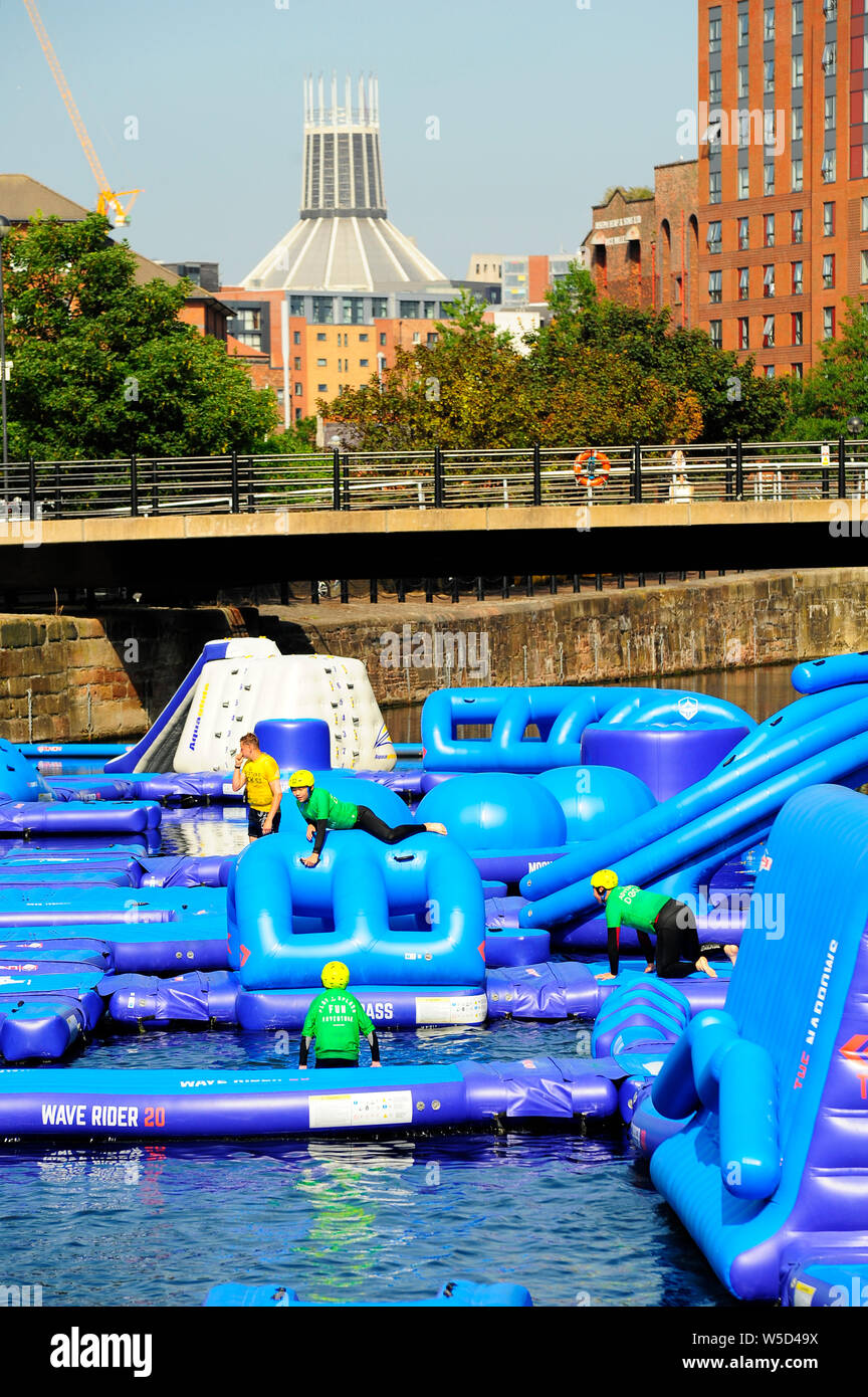 Children on the play and splash fun pontoons in Albert Dock,Liverpool Stock Photo