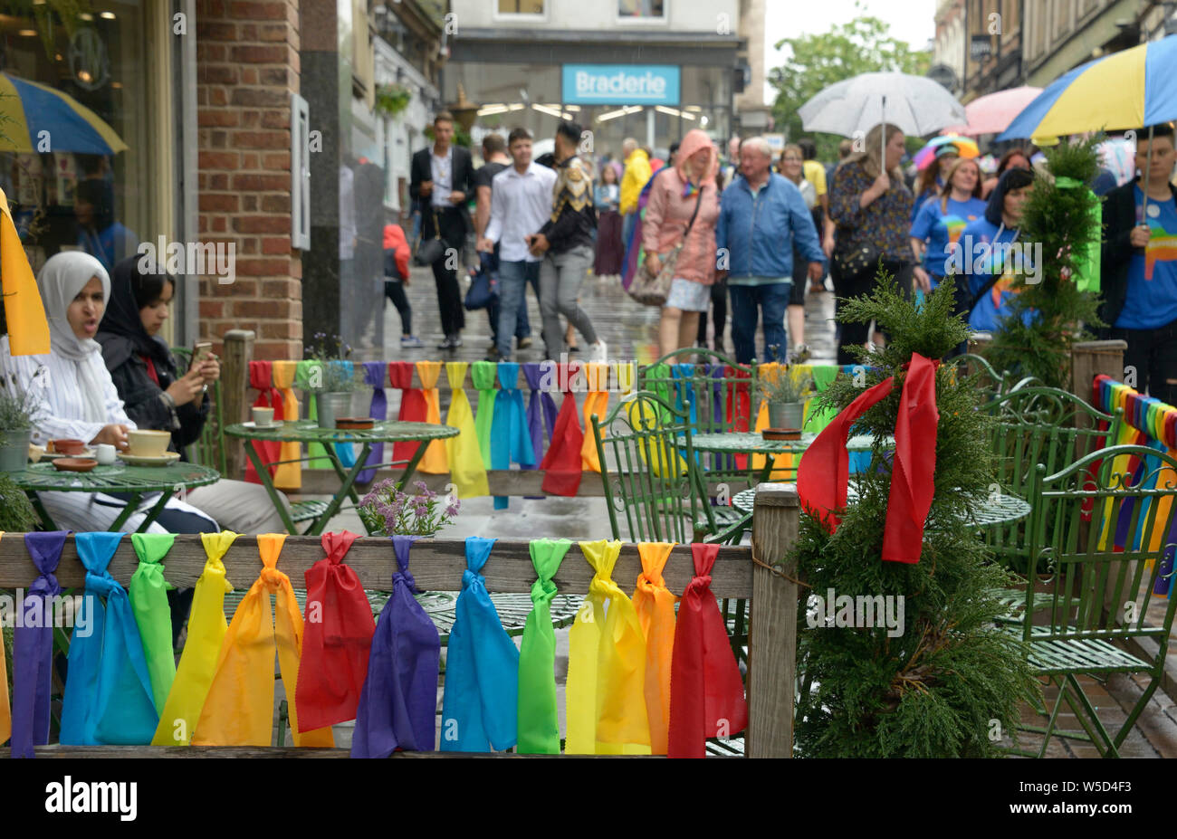 Rainbow coloured ties around a pavement cafe at Pride event in Nottingham Stock Photo
