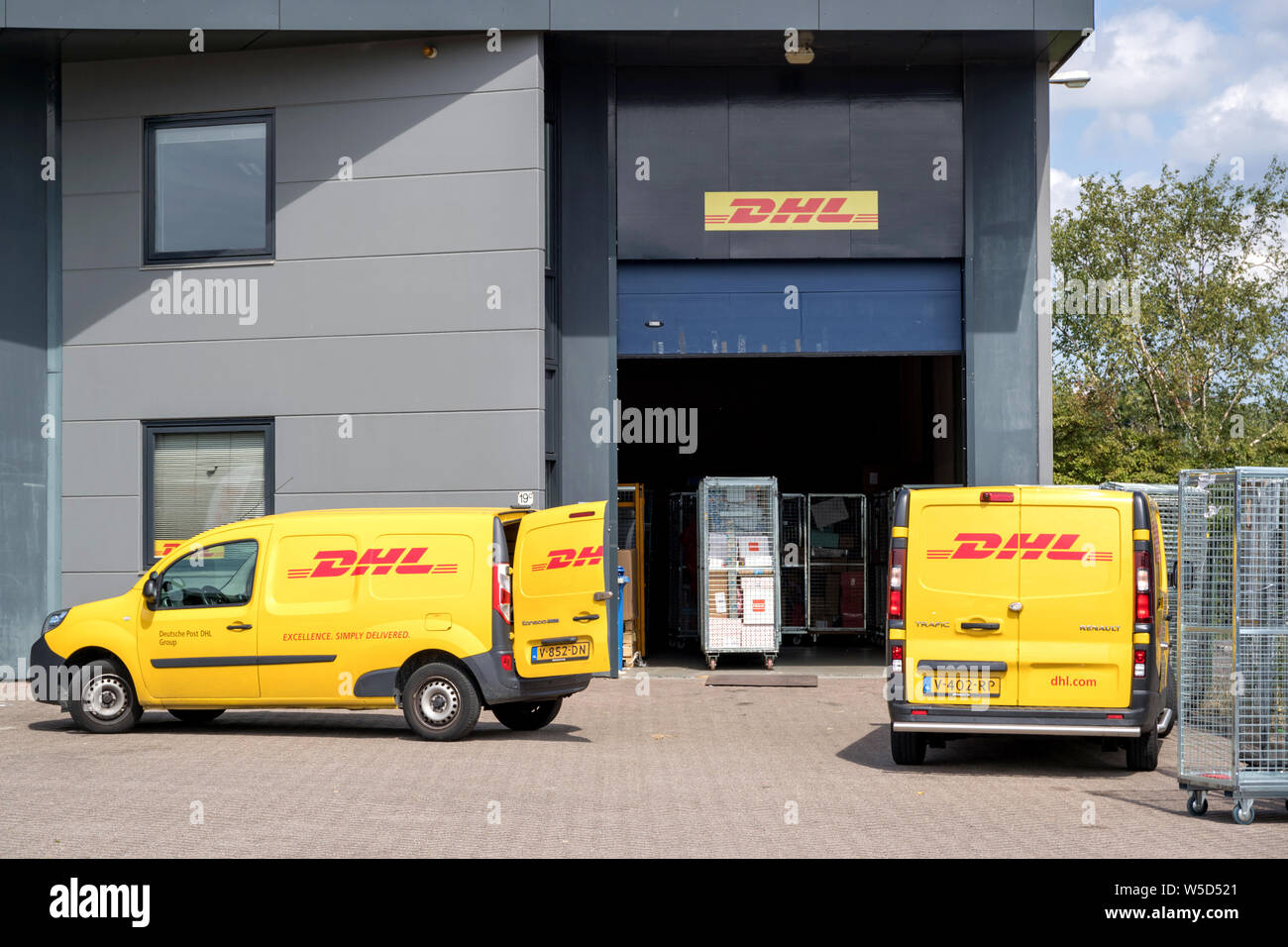 DHL depot. DHL is a division of the German logistics company Deutsche Post AG providing international express mail services. Stock Photo