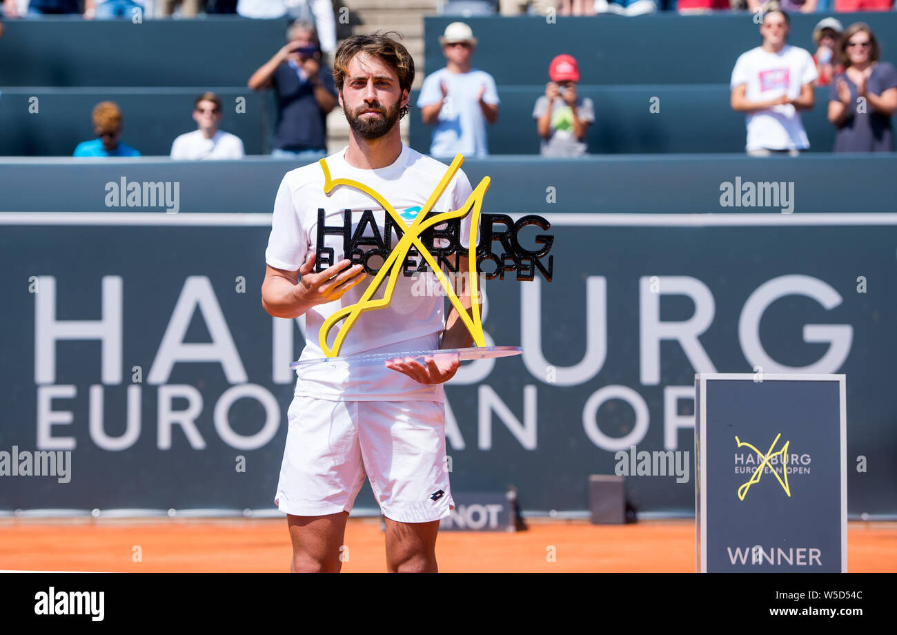 Hamburg, Germany. 28th July, 2019. Tennis, ATP-Tour, Hamburg European Open,  singles, men, final in the stadium at Rothenbaum: Rubljow (Russia) -  Bassilaschwili (Georgia). Nikolos Basilashvili holds the trophy after his  victory. Credit: