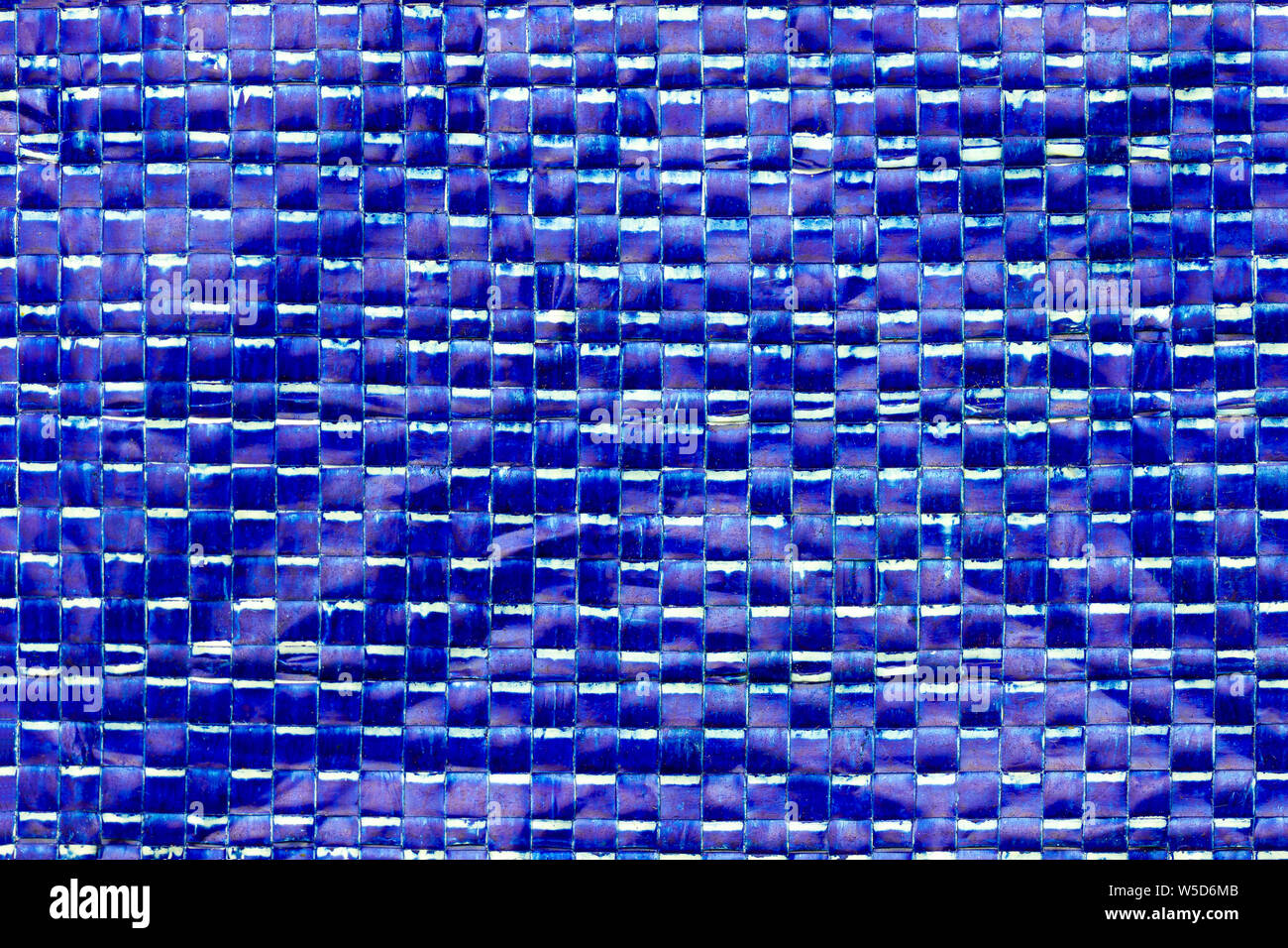 Texture of blue plastic net bag. Concept of recycle product or global