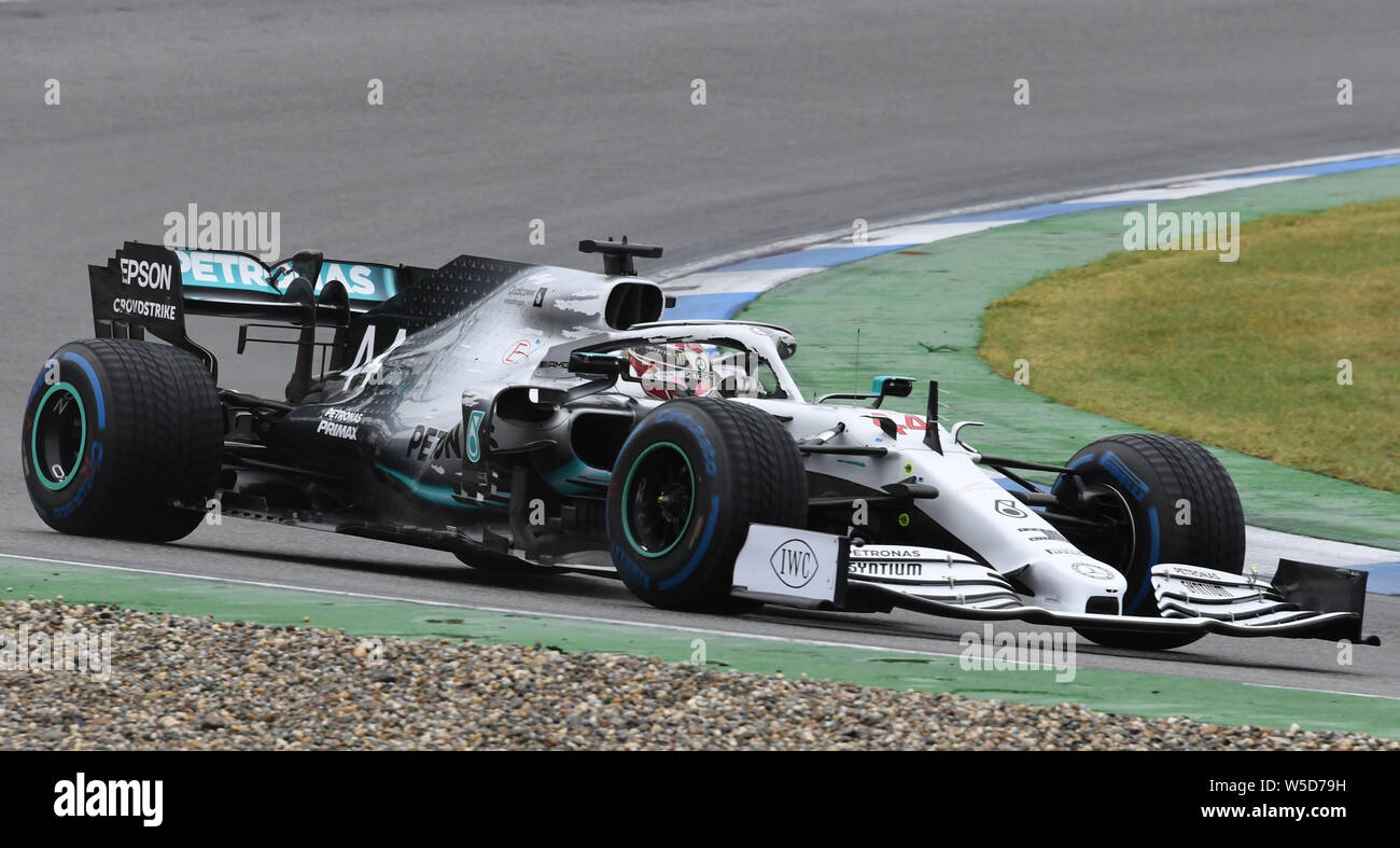 Hockenheim, Germany. 28th July, 2019. Motorsport: Formula 1 World Championship, Grand Prix of Germany. Lewis Hamilton from Great Britain of the Mercedes-AMG Petronas team drives across the track. Credit: Uli Deck/dpa/Alamy Live News Stock Photo