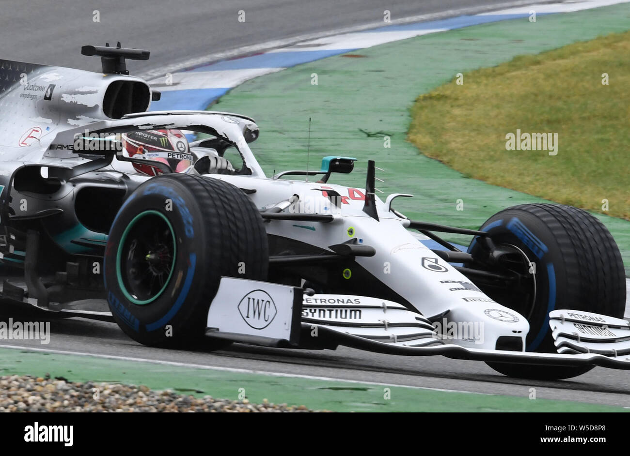 Hockenheim, Germany. 28th July, 2019. Motorsport: Formula 1 World Championship, Grand Prix of Germany. Lewis Hamilton from Great Britain of the Mercedes-AMG Petronas team drives across the track. (RECROP) Credit: Uli Deck/dpa/Alamy Live News Stock Photo