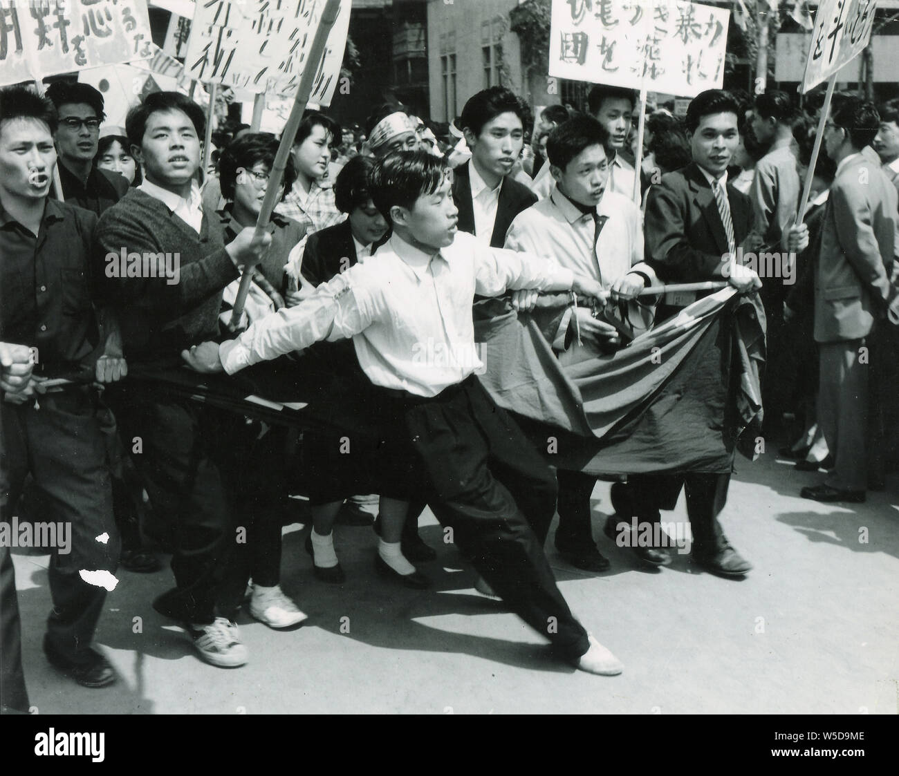 [ 1960s Japan - US-Japan Security Treaty Protest ] —   Japanese students demonstrating against the Treaty of Mutual Cooperation and Security between the United States and Japan (安保条約), Tokyo, 1960 (Showa 35). Stock Photo