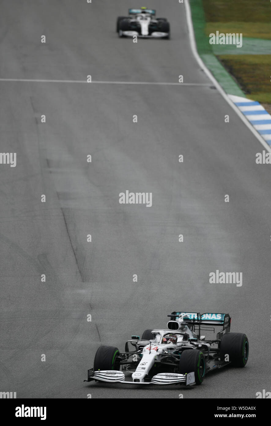 Hockenheim, Germany. 28th July, 2019. Motorsport: Formula 1 World Championship, Grand Prix of Germany. Lewis Hamilton from Great Britain of the Mercedes-AMG Petronas team drives across the track. Credit: Fabian Sommer/dpa/Alamy Live News Stock Photo