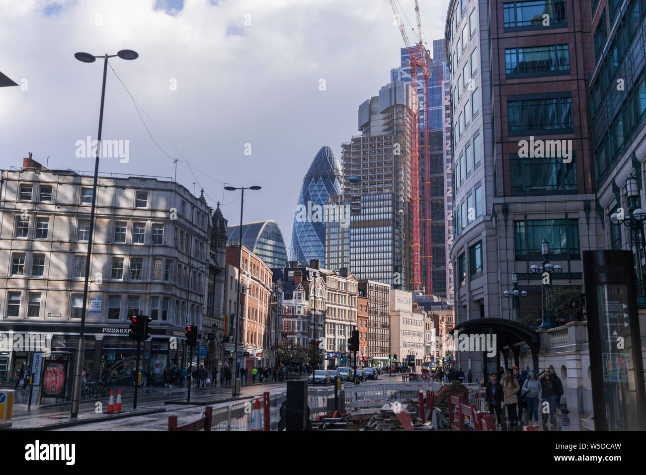 A view of 30 St Mary Axe during sunset,also known as The Gherkin, is a skyscraper in The City Of London. Stock Photo