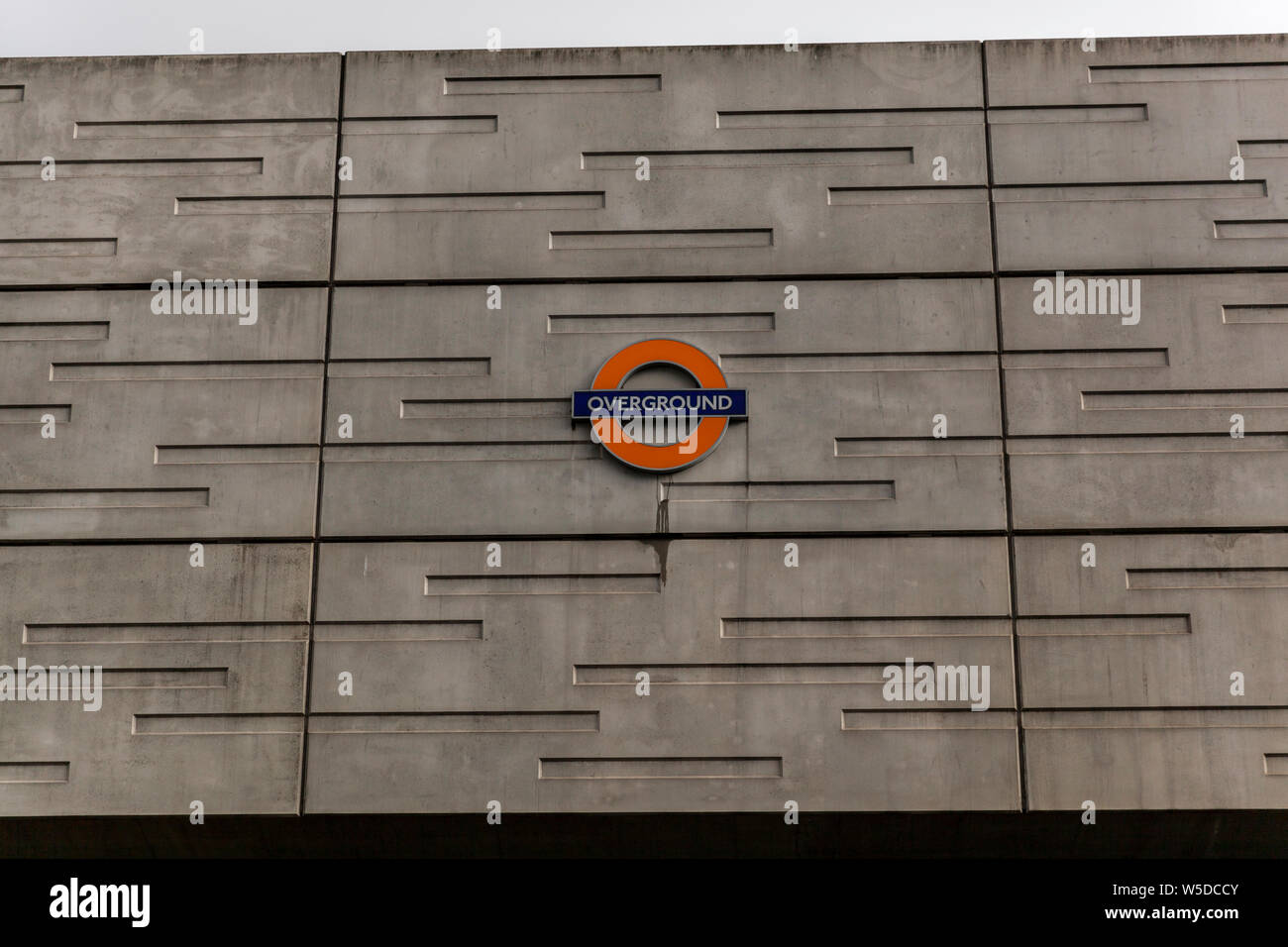 The London OVERGROUND sign on a wall in London Stock Photo
