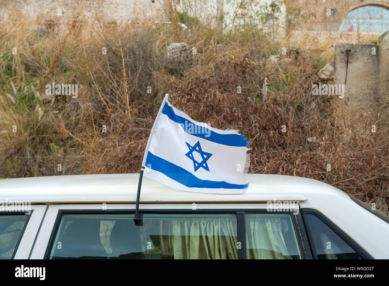 Israeli flag on a car, blue and white Magen David, Israel Stock Photo