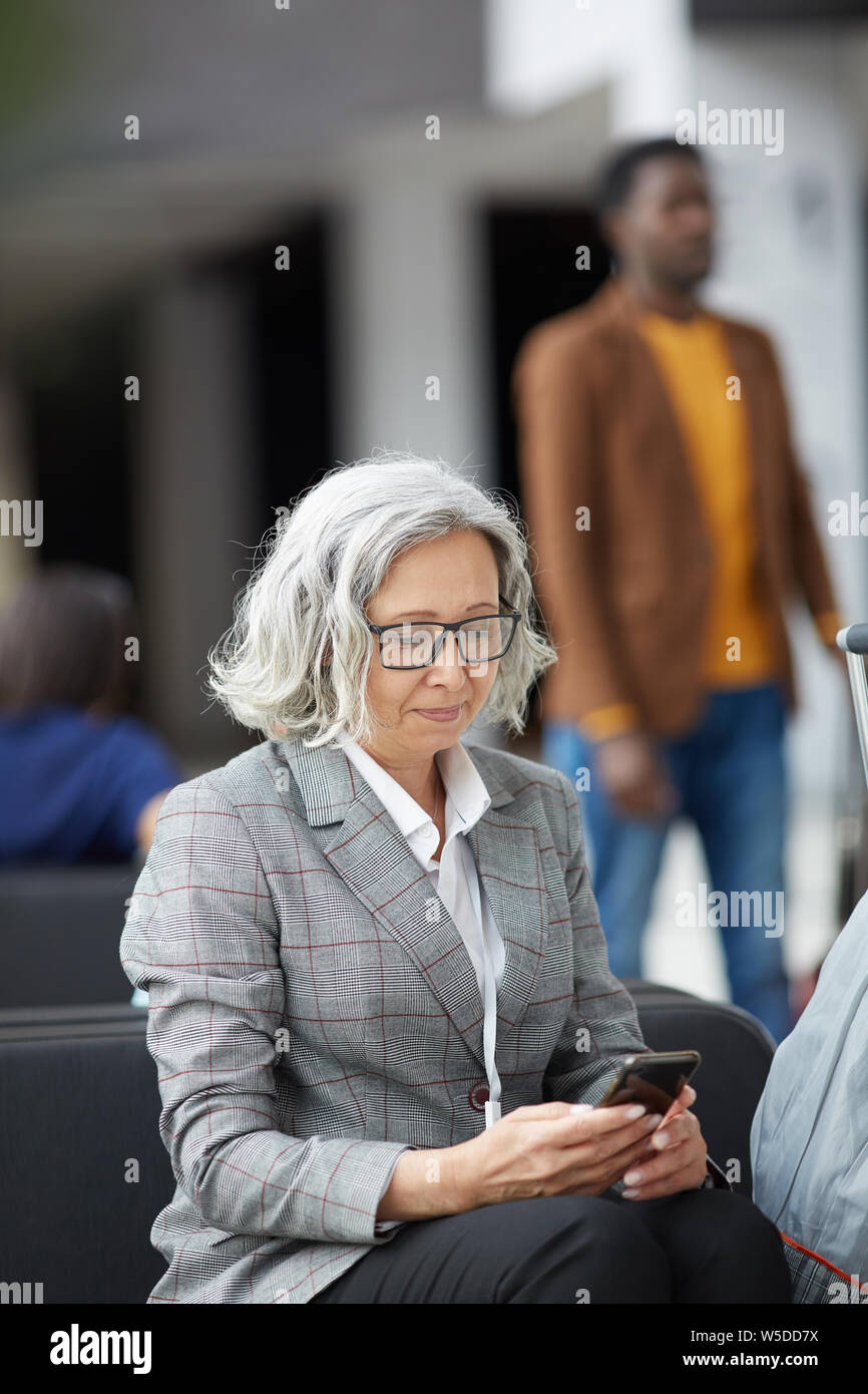 Content Senior Business Lady With Short Curly Hair Wearing