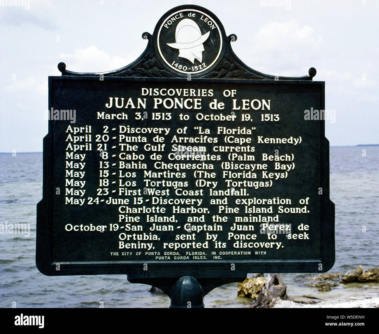 An historical plaque summarizes the discoveries made in 1513 by Spanish explorer Juan Ponce de Leon when his sailing ships navigated around an unknown peninsula that he named La Florida. Although Native Americans had lived on the land for thousands of years, the Spaniard was the first to make written records of Europeans visiting Florida. Initially in search of the island of Bimini (Beniny), when Ponce de Leon's expedition of three ships and 200 men landed in Florida, they did not realize it was part of the mainland of North America. Stock Photo