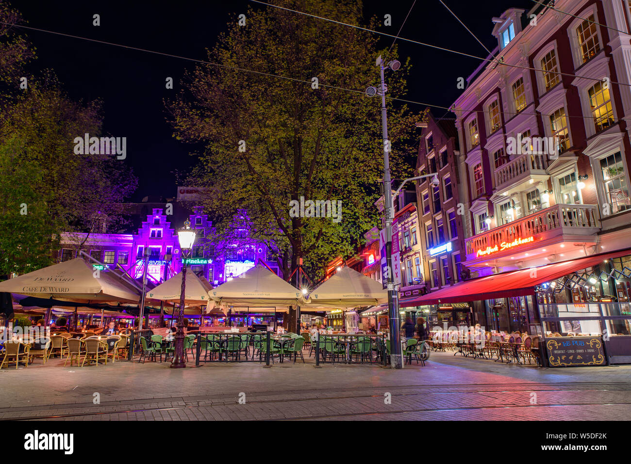 Night view of the Rembrandtplein square in Amsterdam, Netherlands Stock Photo