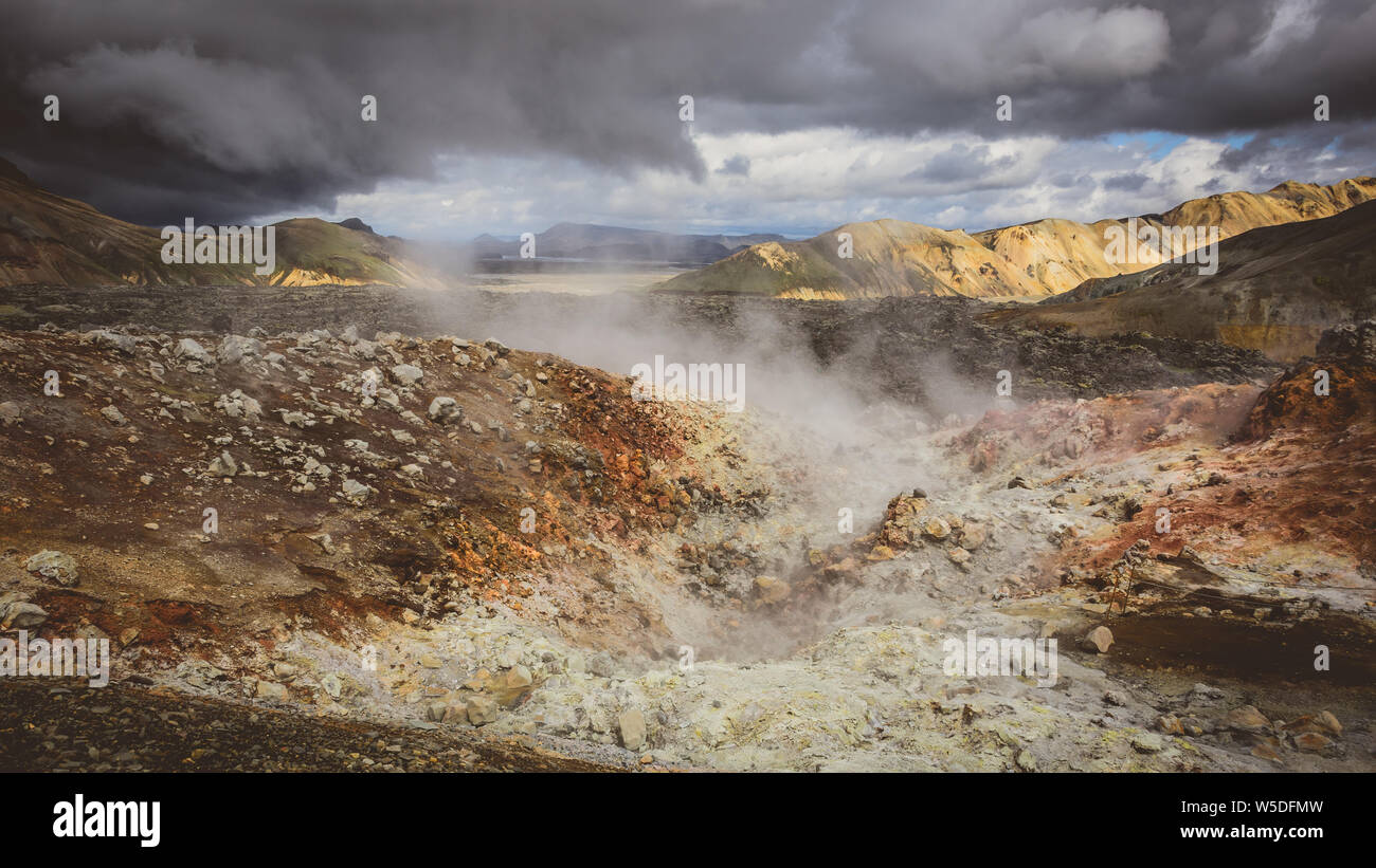 Steam rising from the volcanic mountains in Iceland Stock Photo