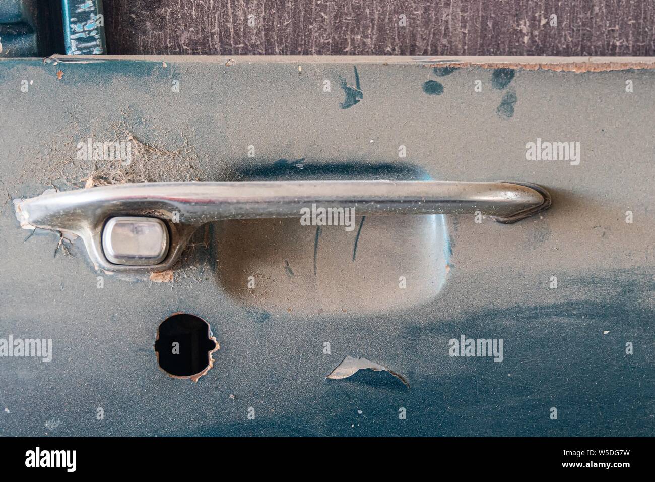 Abandoned car with missing lock part Stock Photo Alamy