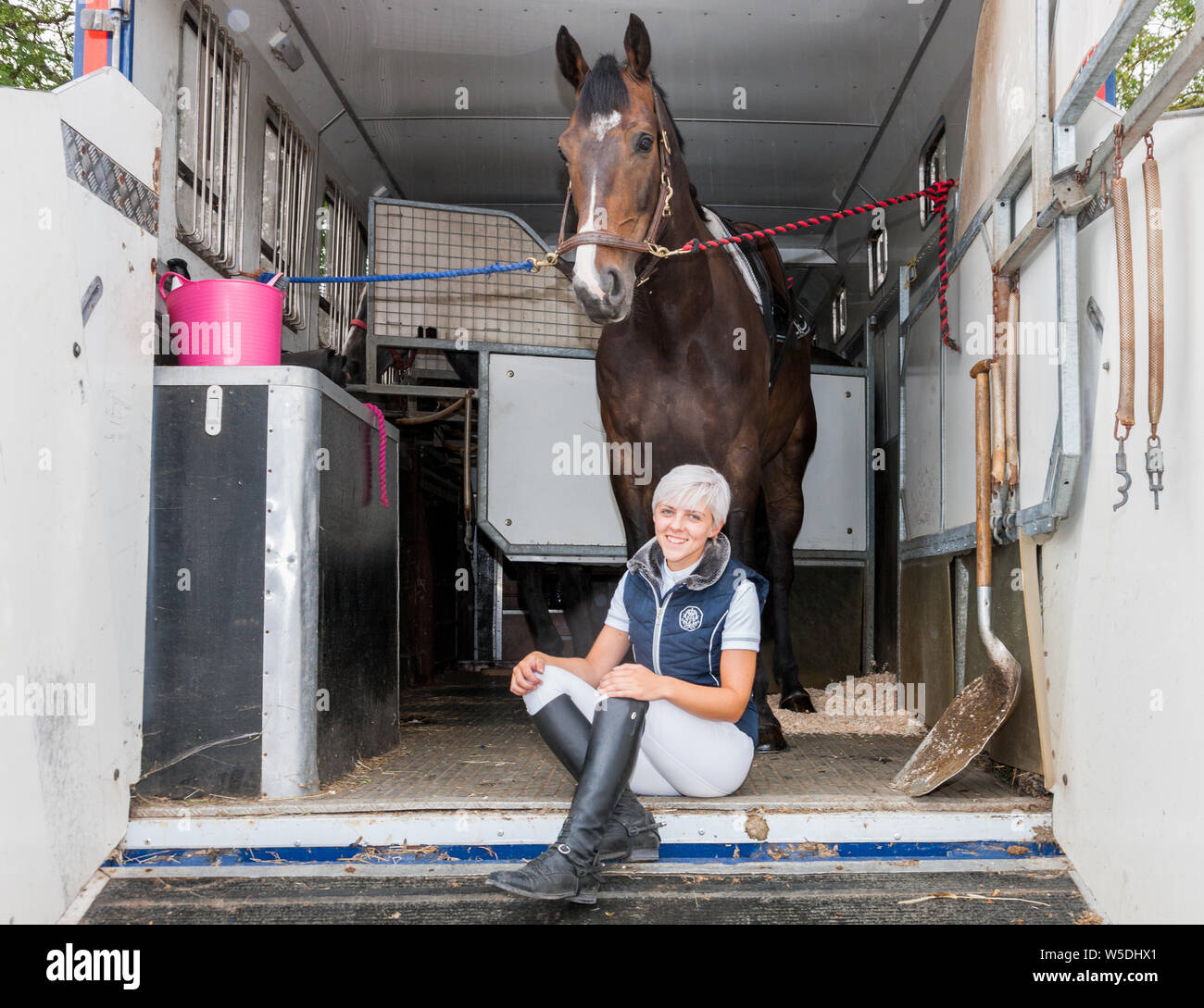 Carrigaline, Cork, Ireland. 28th July, 2019. Jamie Garland preparing her horse Zedlepplin prior to taking part in the 1.5m New Height Champions Series during the Premier Grand Prix, 3-day event that was held at the Maryville Equestrian Centre in Carrigaline, Co. Cork, Ireland.Credit;  David Creedon / Alamy Live News Stock Photo